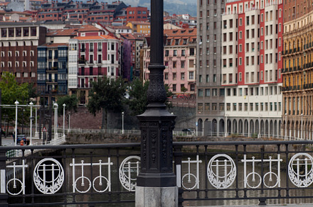 Street lamp and railing on the river bridge in the centre of Bilbao, an Architecture Photo by Bepslabor