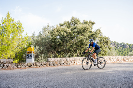 Athlete training road cycling on a, a Sports & Recreation Photo by Xavi Bosch Stock