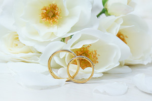 Wedding rings & white roses containing rose, wedding, and white