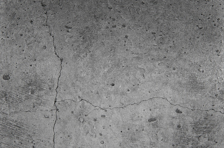 Concrete wall texture with cracks containing abstract, aged, and ancient