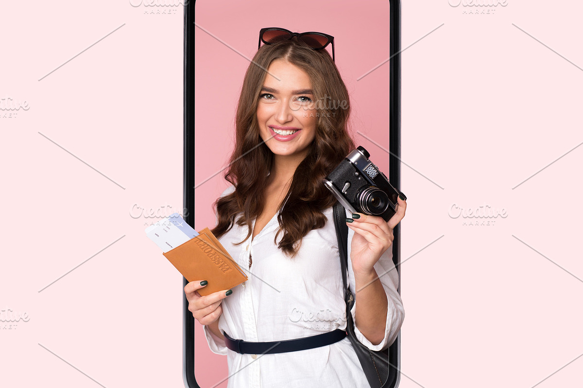Female Tourist In Phone Screen Holding Camera On Pink Background, a Photo by Prostock-Studio (Photo 4 of 8)