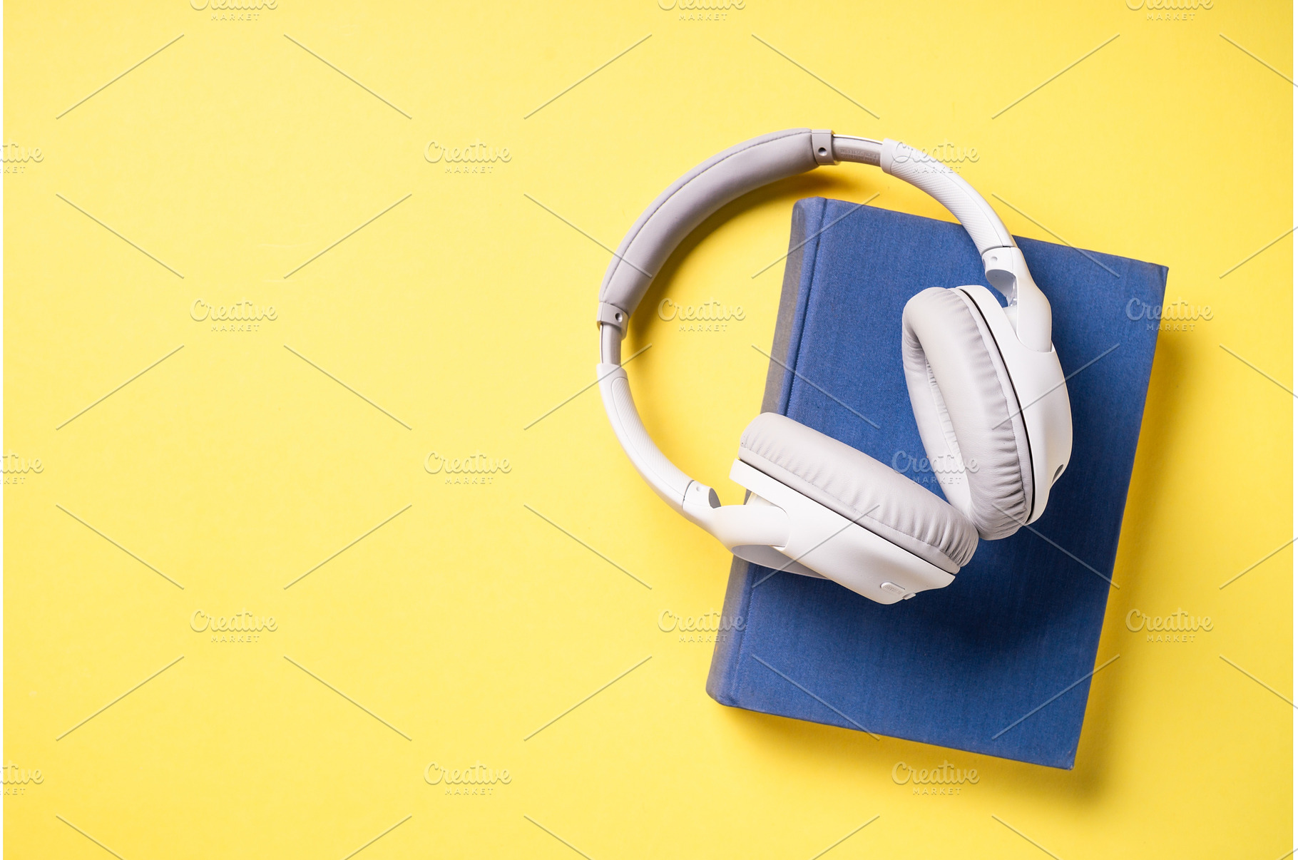 Headphones and books on blue, a School & Education Photo by Nadia-nb