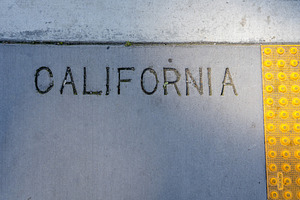 Engraved California text on a concrete sidewalk in San Francis, an Architecture Photo by GoodGoods