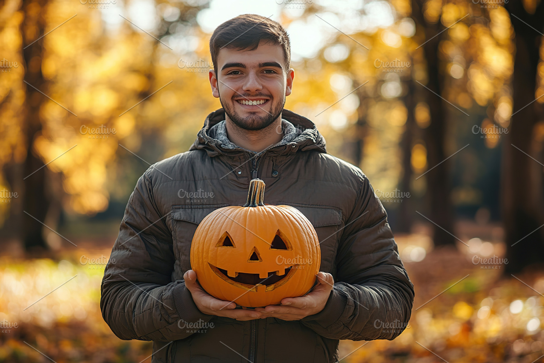 Young man holds halloween pumpkin jack o lantern in autumn park, a Person Photo by AlyaAnd