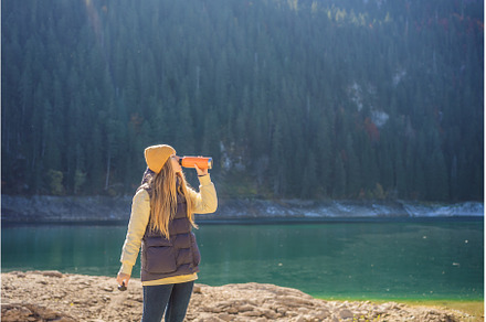 Woman tourist in background of, a Nature Photo by Elizaveta Galitskaya