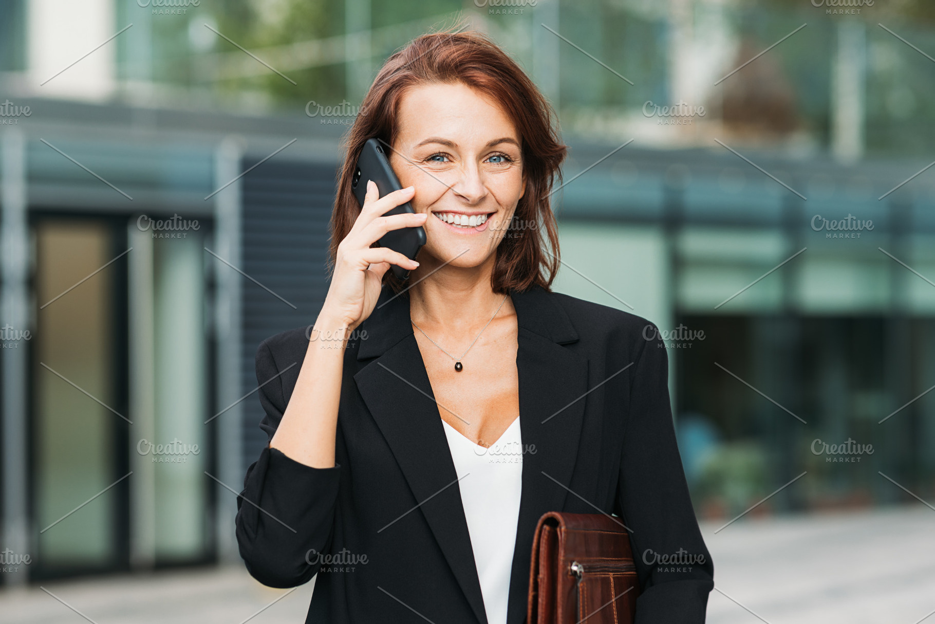 Happy businesswoman with ginger hair, a Business Photo by Artem Varnitsin