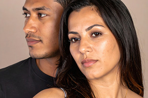 Young couple portrait with woman looking forward confidently, a Person Photo by GoodGoods