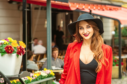 Woman is posing in the city street, a Person Photo by okskukuruza