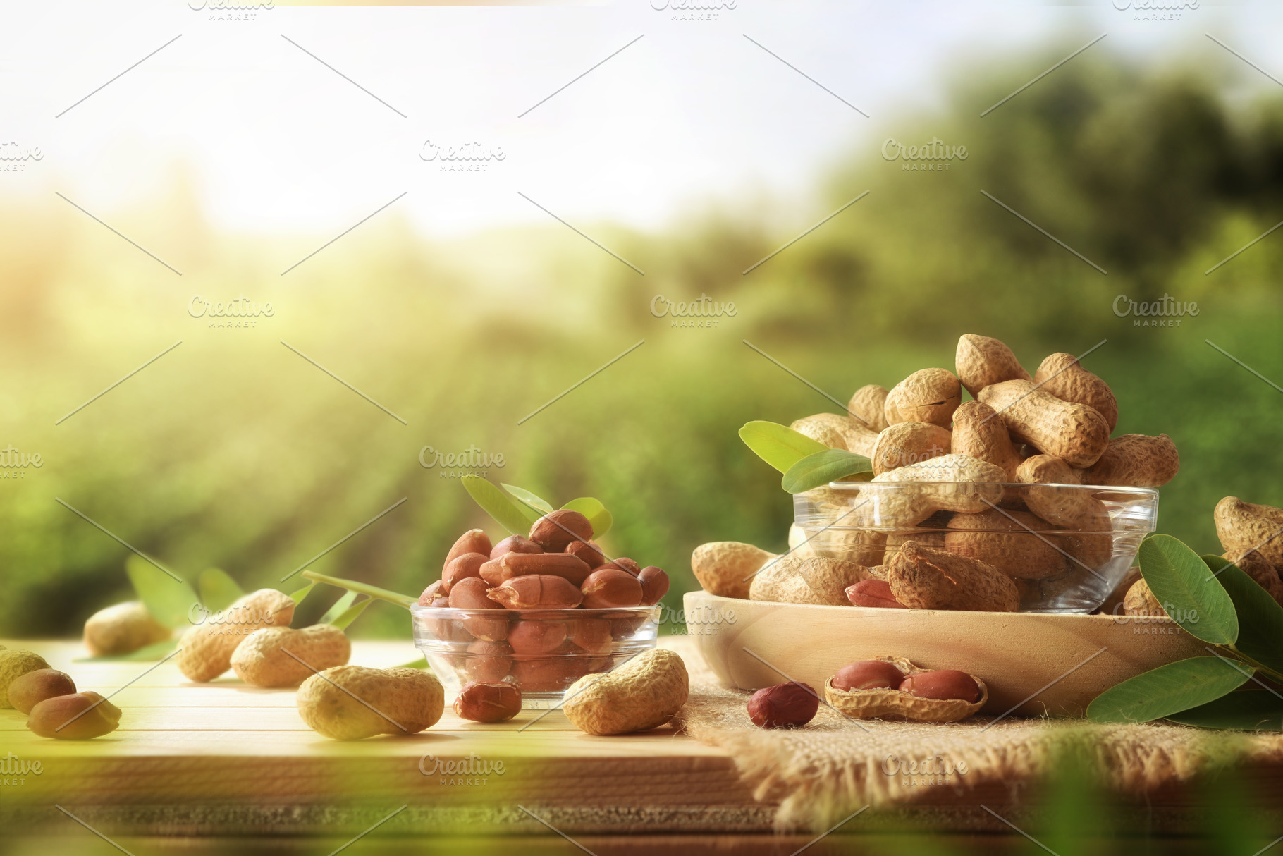 Peanuts on wooden table with crop fields in the background, a Food & Drink Photo by Davizro's Market