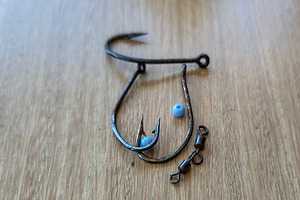 Fishing hooks on wooden surface, a Sports & Recreation Photo by DanFLCreativo