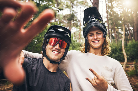Forest, cycling and friends take a selfie in nature on an outdoor bicycle adventure in the woods in summer. Sports, bikers and happy men in a picture for fun biking memories on holiday vacation, a Photo by Peopleimages.com