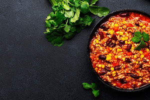 Chili con carne with beef, red beans, paprika, corn and hot pepp