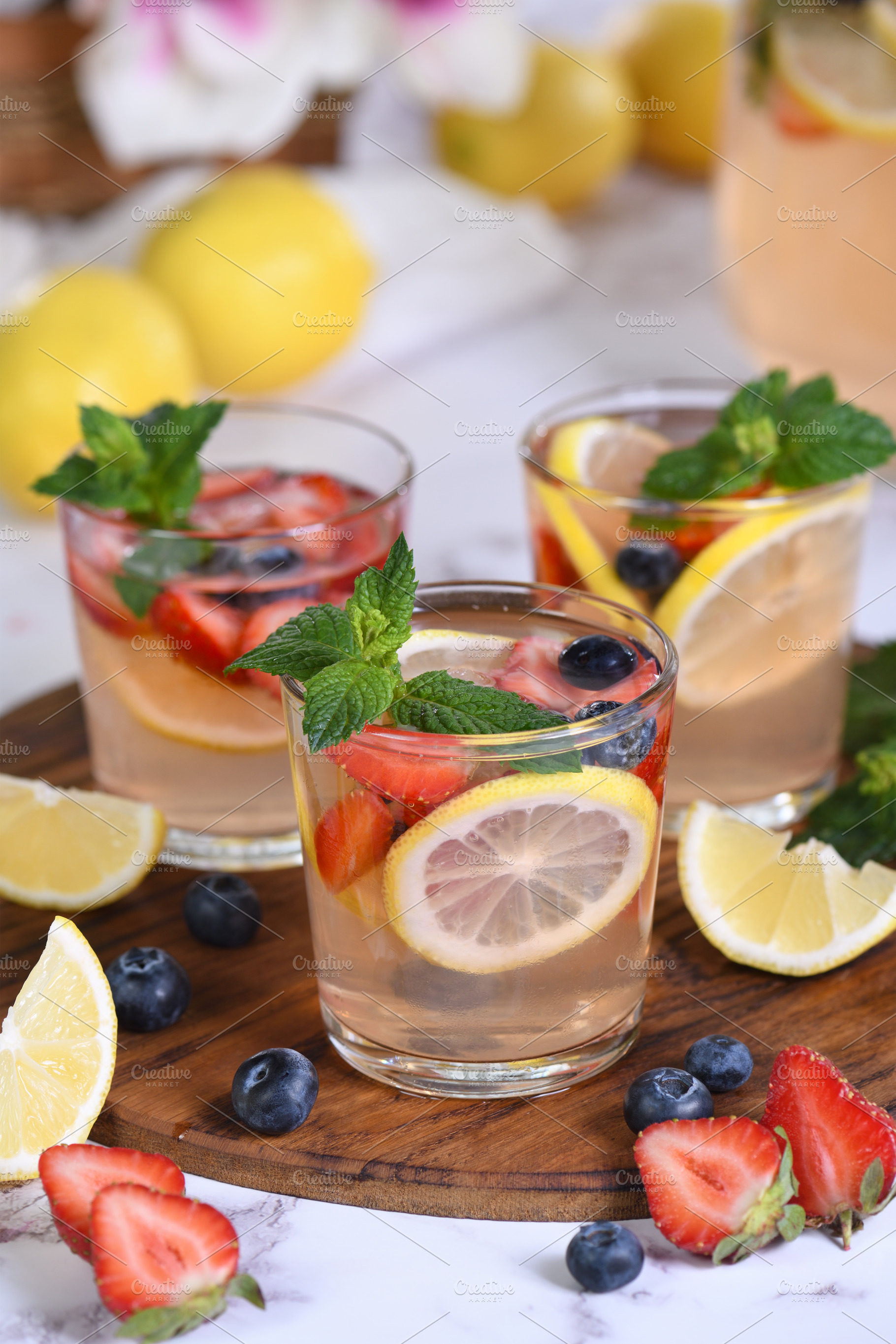 Lemonade with strawberries, blueberr, a Food & Drink Photo by Apolonia