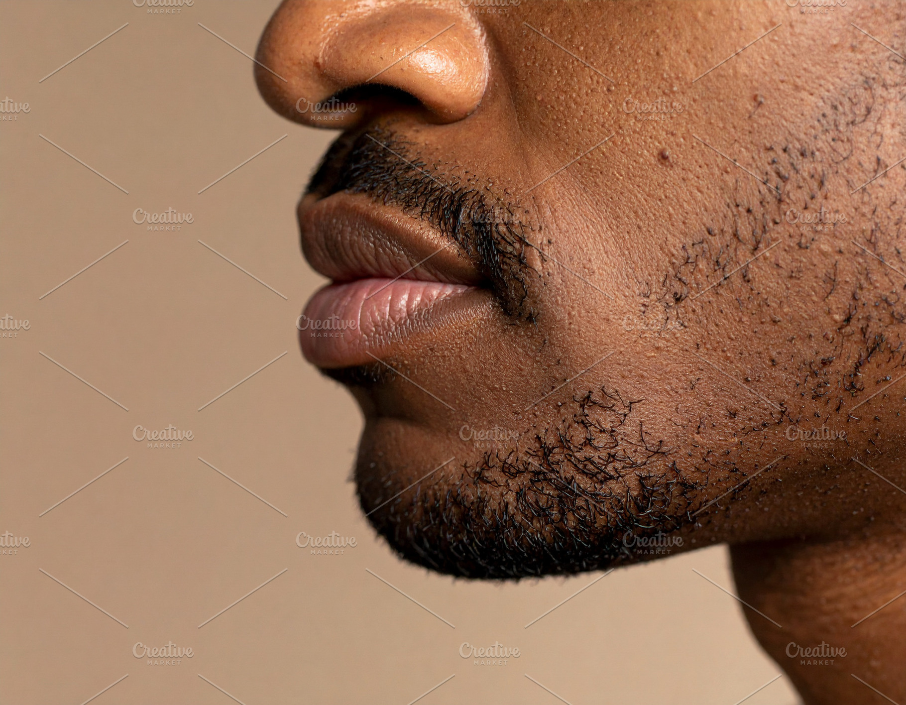 Cheek and lips adult black man showing skin texture with natural, a Health & Medical Photo by DanFLCreativo