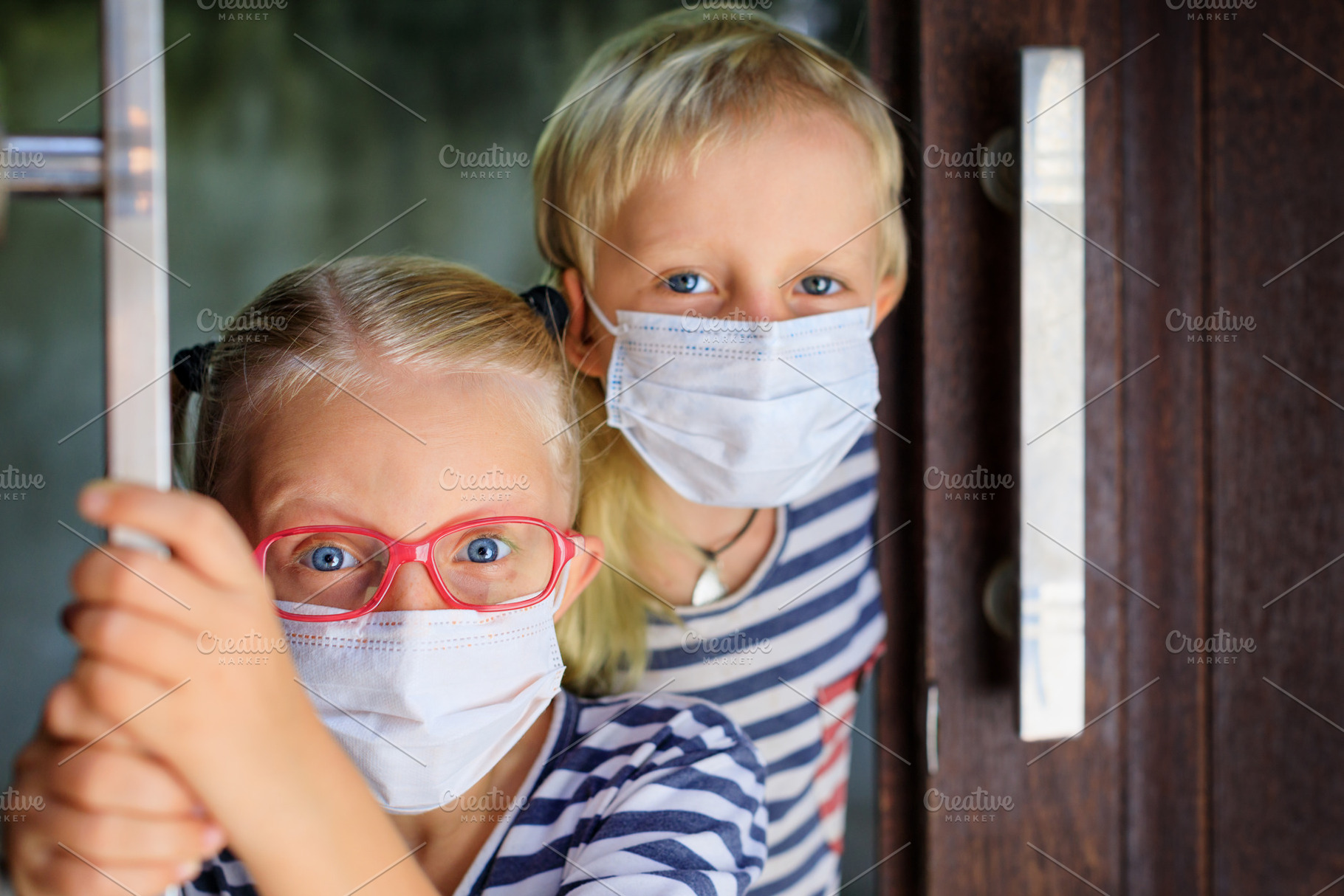 Kids wearing face masks stock photo containing face and mask, a Person Photo by Tropical Studio