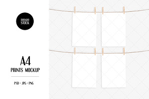 A4 print mockup with clothespins