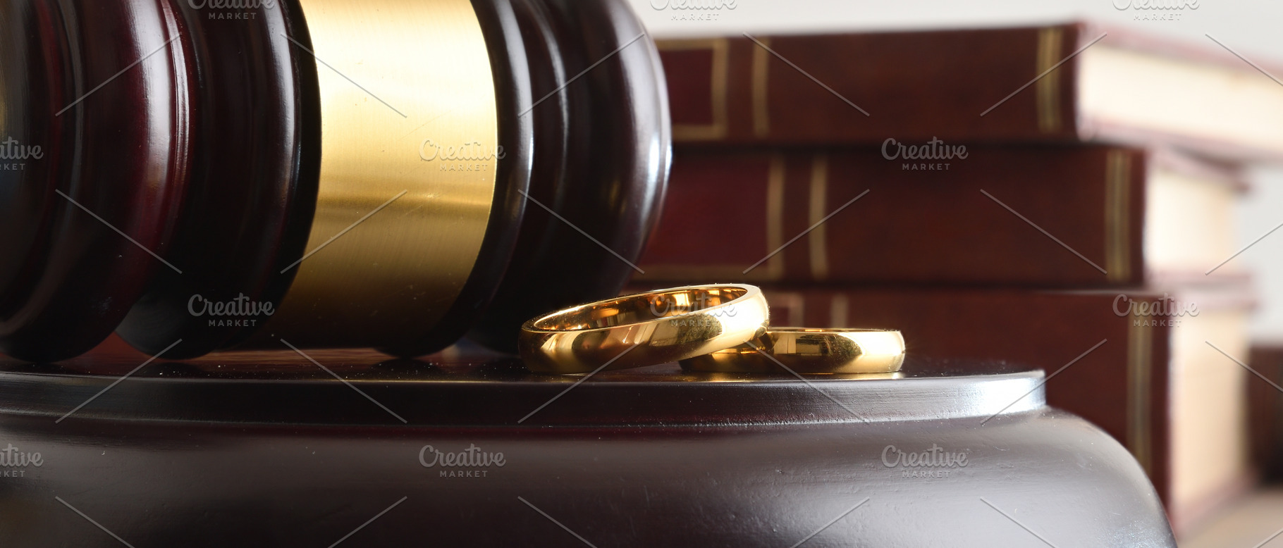 Wooden Gavel and Wedding Rings on Legal Bench, an Abstract Photo by Davizro's Market