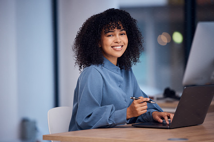 Happy, working and portrait of a black woman on a laptop for email, connection and internet. Business, smile and employee typing on a computer for online work, project and freelancing in office, a Photo by Peopleimages.com