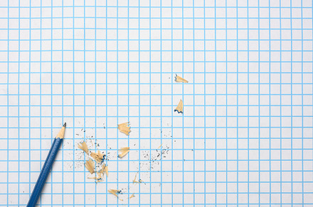 sharpened wooden pencil with shavings on a checkered paper sheet, a School & Education Photo by ndanko