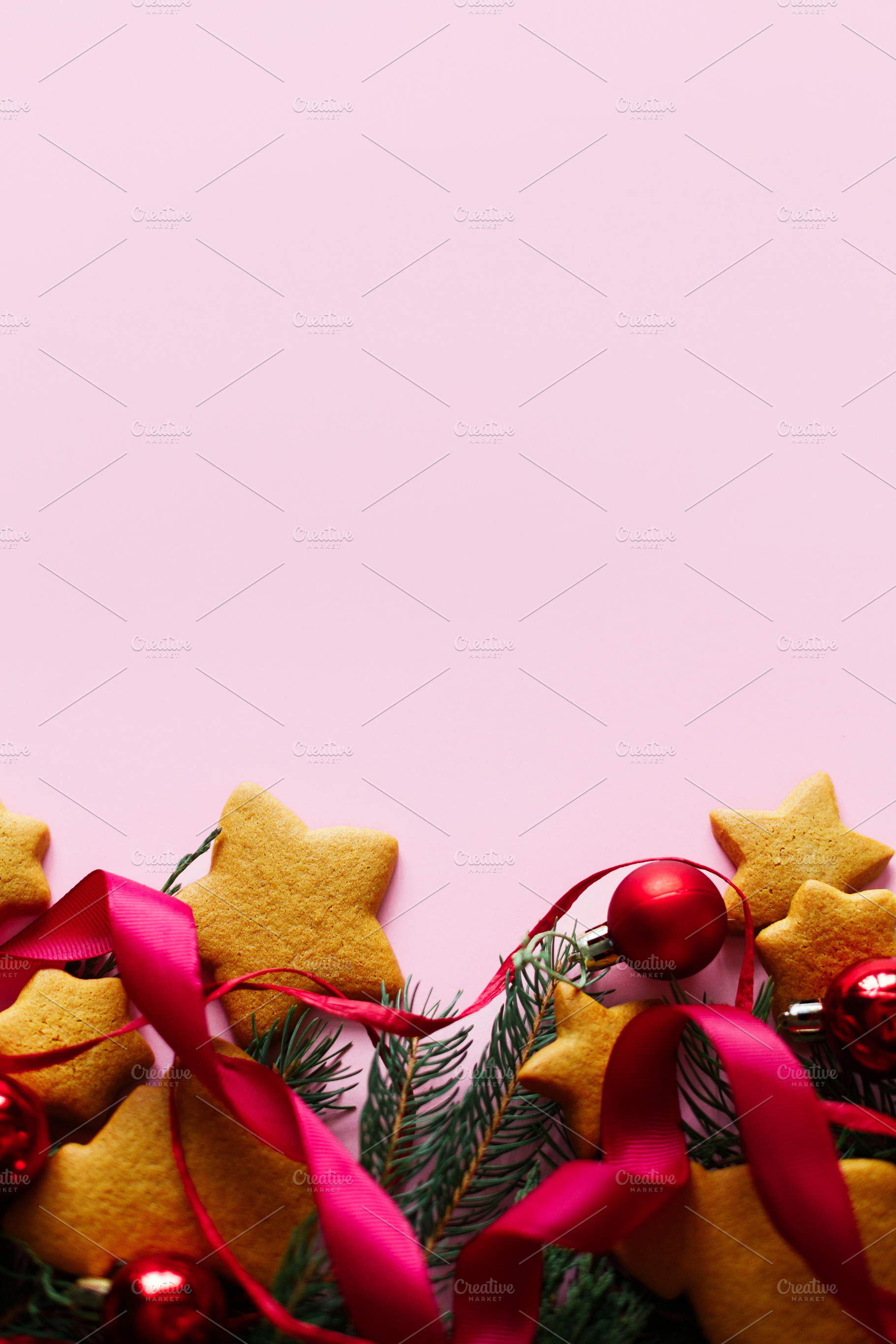 Christmas background with gingerbread cookies, red ribbon and ba, a Photo by Sonjachni