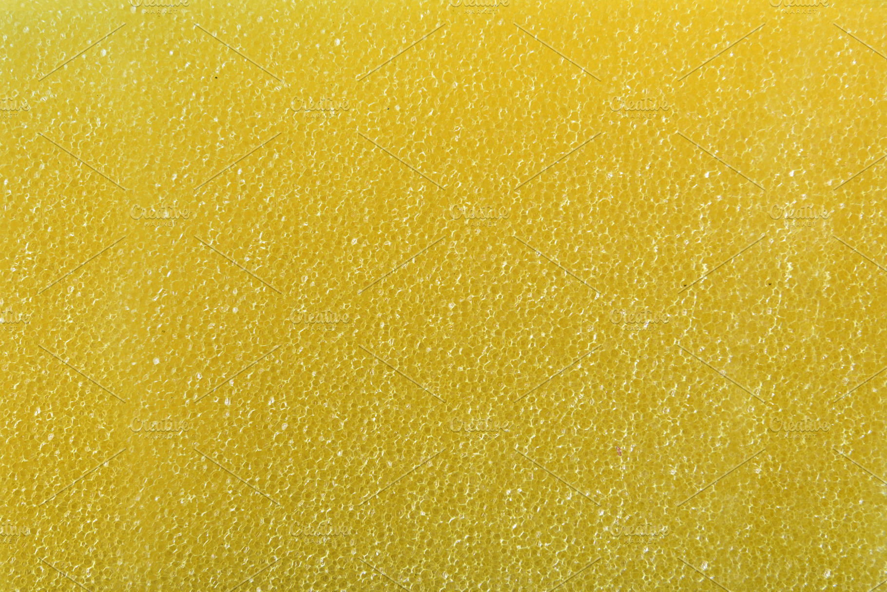 Detail of texture of synthetic yellow sponge with tiny holes, an Abstract Photo by Davizro's Market