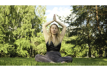 Young beautiful woman doing yoga in, a Person Photo by Media Whale Stock