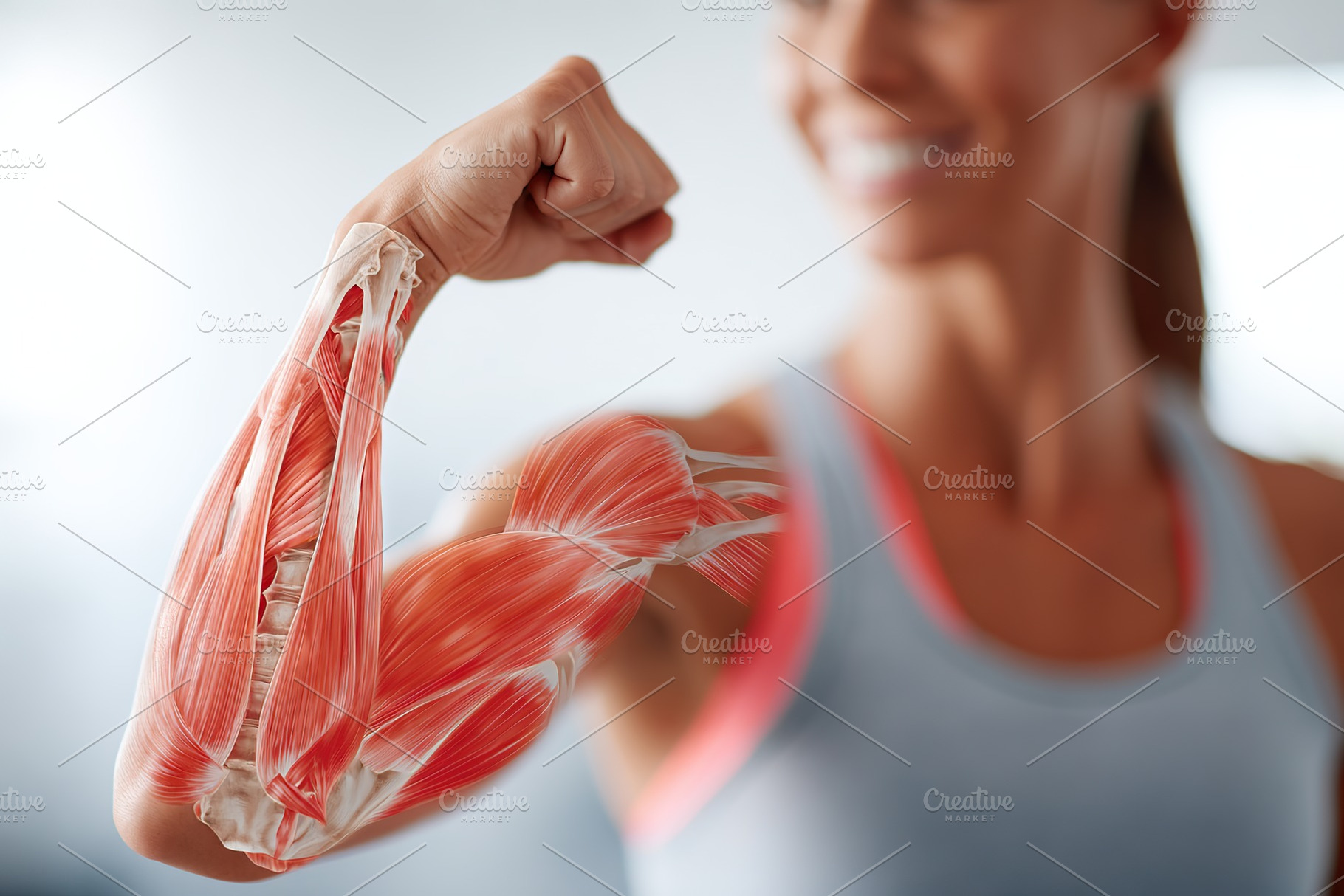 Woman showing anatomical bicep flex in fitness center during workout session, a Sports & Recreation Photo by AlyaAnd