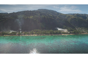Smoke rising from tropical village, a Nature Photo by Goinyk