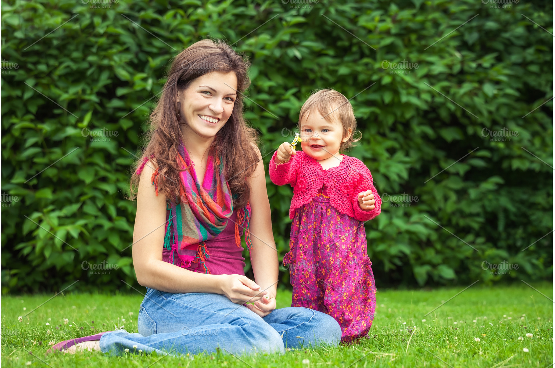 Mother with baby in the park, a Person Photo by sborisov