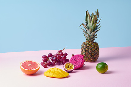 Tropical fruits variety on a colorful background. Side view with