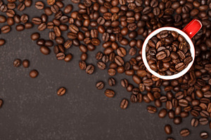 Freshly roasted coffee beans in red