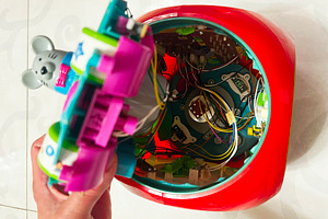 Close-up of dismantled toy showing colorful circuits and internal mechanical co, a Photo by AS photostudio