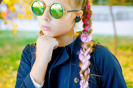 blonde girl wearing a sunglasses  with pink kanekalon in hair in, a Person Photo by vimart