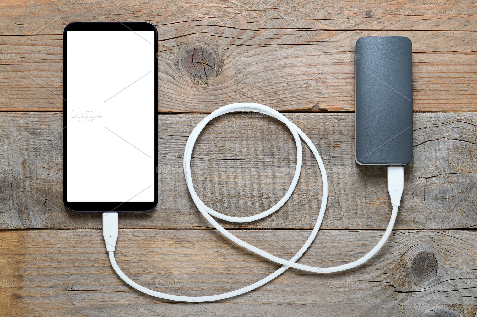 Power bank and smartphone, a Technology Photo by Anatoliy Sadovskiy