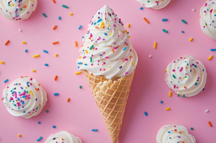 Ice cream cone with sprinkles surrou, a Background Photo by Pixeness