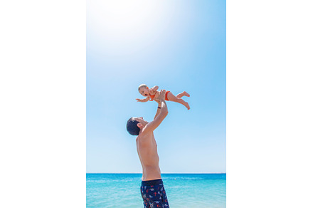 The father tosses the baby against, a Person Photo by yanadjana