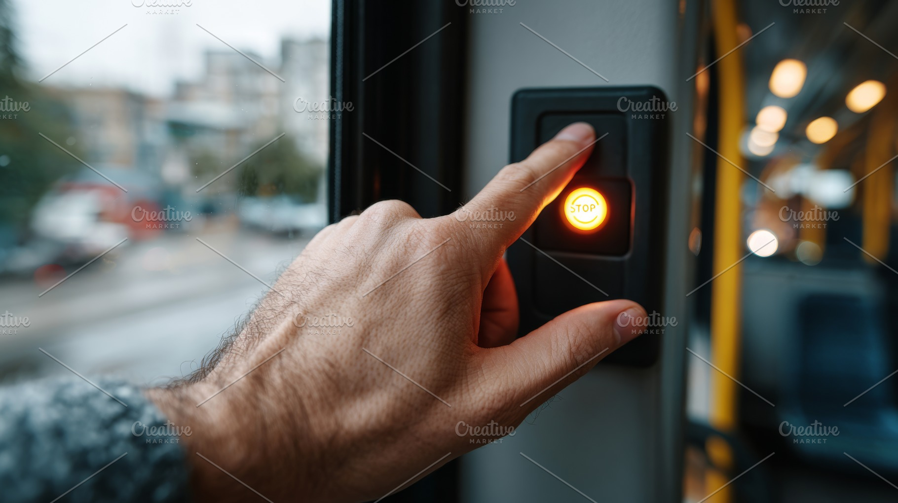 A close-up of a man's hand pressing the stop button on a bus, signaling the dri, a Business Photo by ImageMir