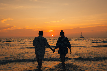 Summer sunset,Couple walking on the beach watching the sunset, a Nature Photo by Art Rachen