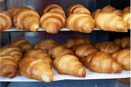 Lots of fresh french croissants on, a Food & Drink Photo by Oleksandr Berezko
