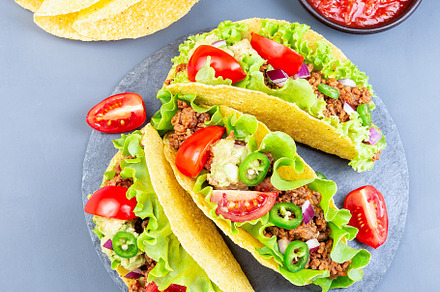 Taco shells with lettuce ground bee containing taco, shell, and lettuce, a Food & Drink Photo by iuliia_n