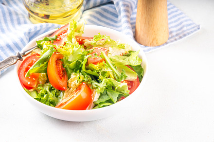 Vegetable salad with lettuce and sliced tomatoes, a Photo by Rimma