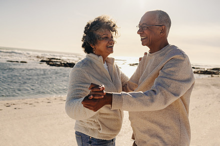 Senior couple dancing together at the beach, a Person Photo by Jacob Lund