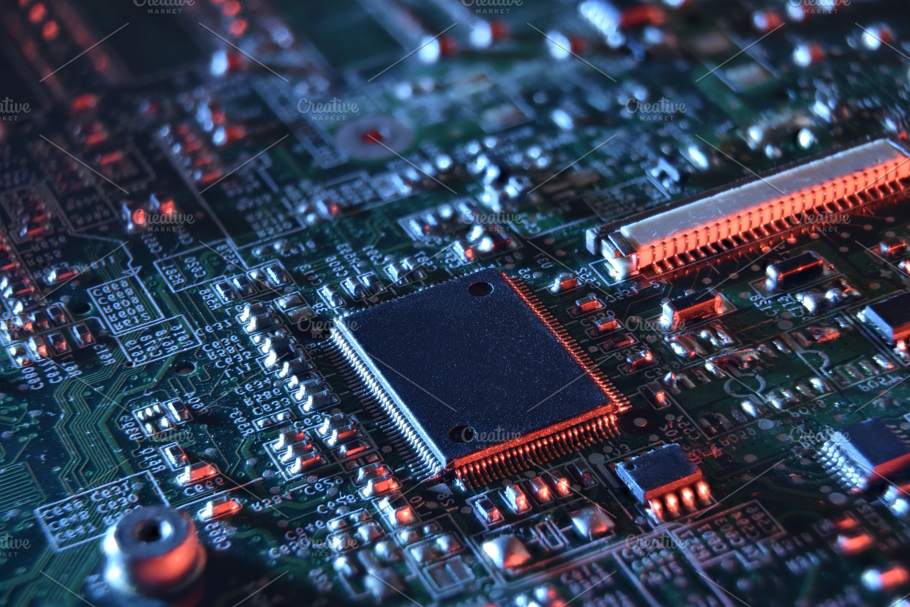 Microchip on Illuminated Circuit Board with blue and red light, a Technology Photo by Davizro's Market