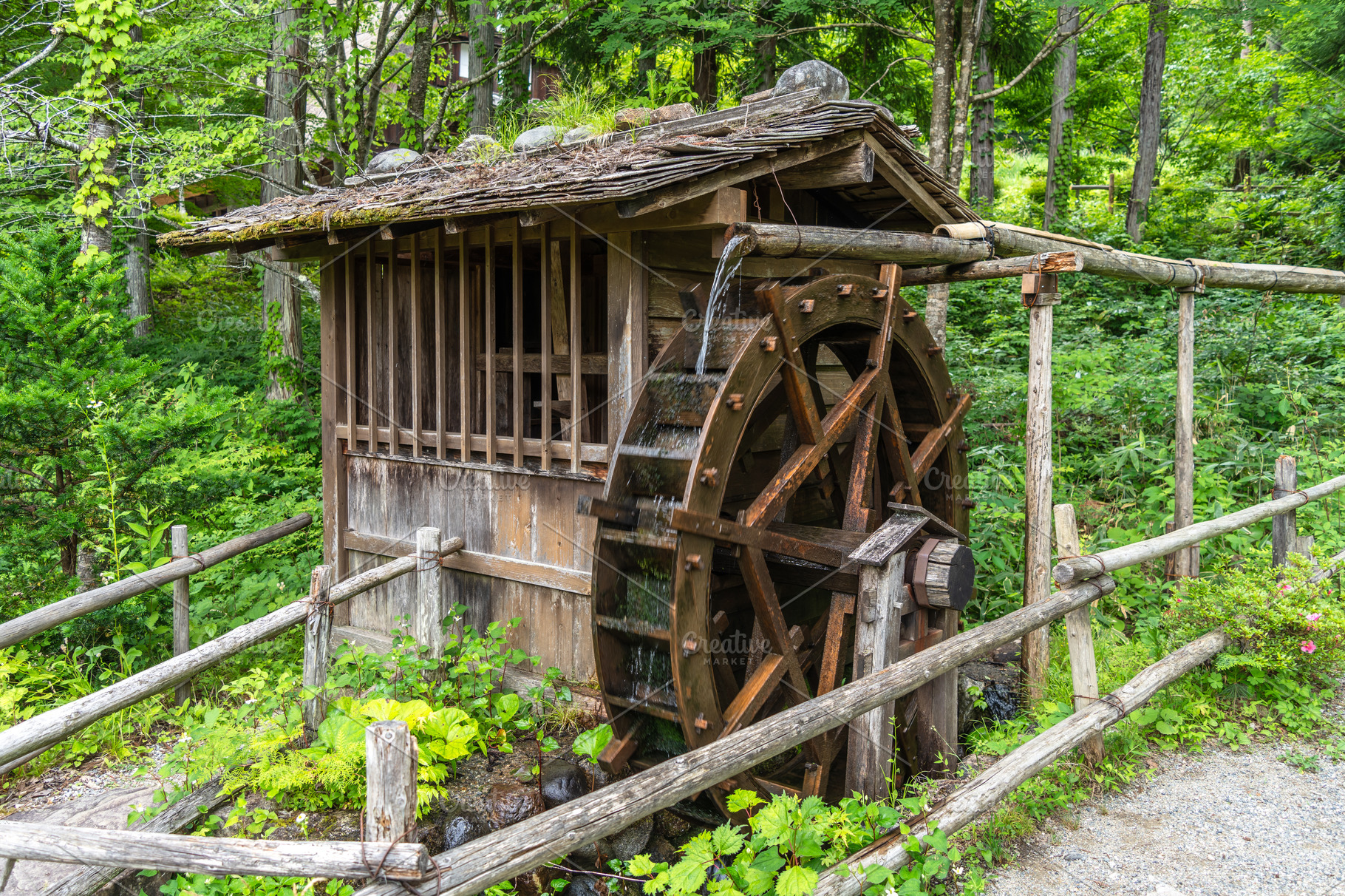 Traditional water mill at Hida Minzoku Mura in Takayama, Japan, an ...