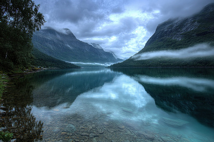 Majestic reflections on the serene L, a Photo by Iftikhar Alam