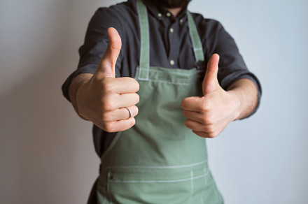 A man in a kitchen apron. Chef work, a Person Photo by Iuliia Pilipeichenko