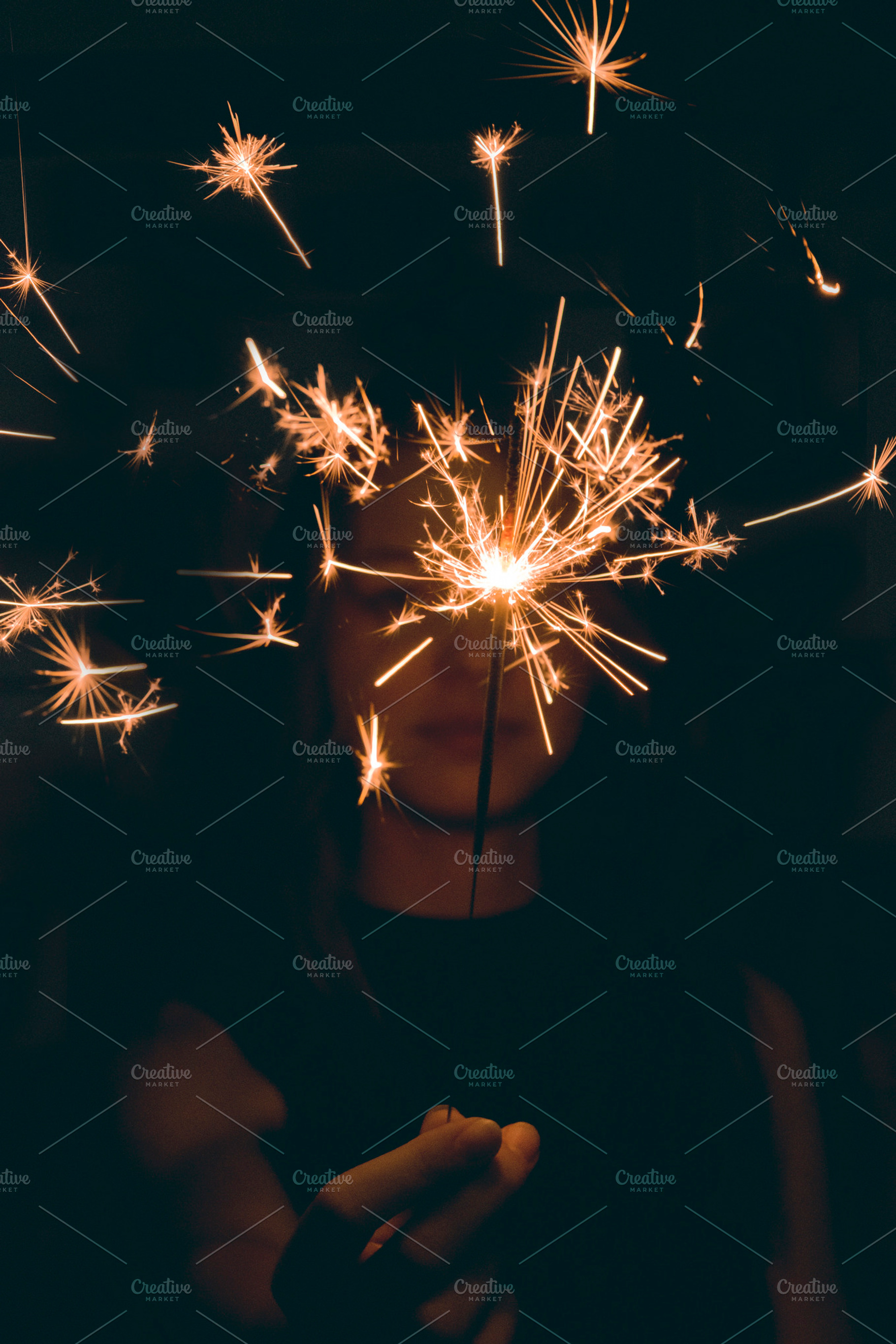 Girl holding sparkler featuring silhouette, black, and dark, a Person Photo by Fossilized Tree Sap