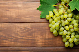 Ripe green grape on wooden background, a Food & Drink Photo by AlyaAnd