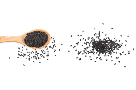 Black sesame seeds in a wooden spoon, a Food & Drink Photo by NataPhoto