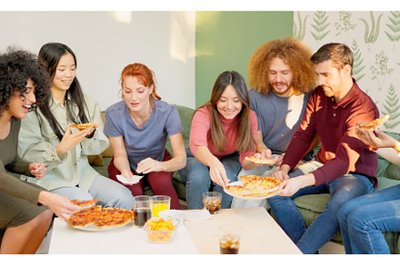 Friends chilling and smiling eating, a Person Photo by Iván Moreno STOCK PHOTO